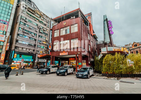 Taiwanese Police Station building with police officer cars parking in the front at Ximending, a popular shopping district in Taipei Stock Photo