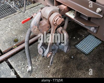 Buffers and Chain Coupler on a Standard Gauge Railway Wagon Painted Brown Stock Photo