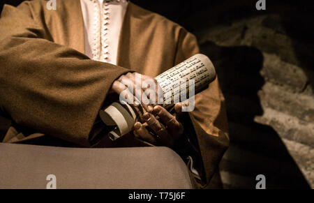 Cordoba, Spain - 2018, Sept 8th: Hand with jewish writings. Fragment from  Life-sized sculpture of Maimonides, medieval Sephardic Jewish philosopher.  Stock Photo