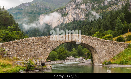 Bujaruelo ancient bridge in Pyrenees range, spain Stock Photo