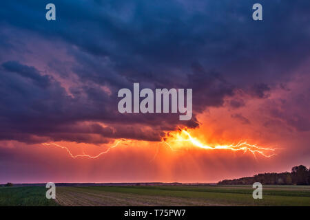 Lightning with dramatic clouds image . Night thunder-storm in Lithuania Stock Photo