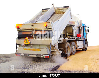 Tar truck in action. White background Stock Photo