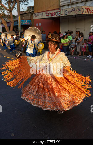 Morenada dancers in traditional Andean costume performing at the annual Carnaval Andino con la Fuerza del Sol in Arica, Chile. Stock Photo