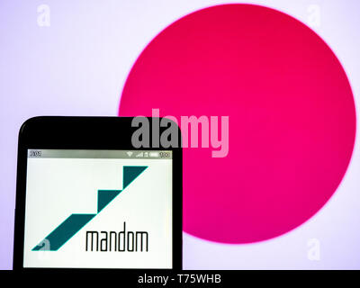 In this photo illustration a Mandom Corporation  logo seen displayed on a smart phone Stock Photo