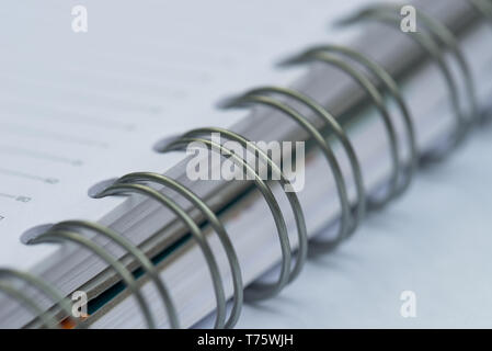open spiral notebook macro selective focus Stock Photo