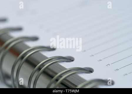 open spiral notebook macro selective focus Stock Photo