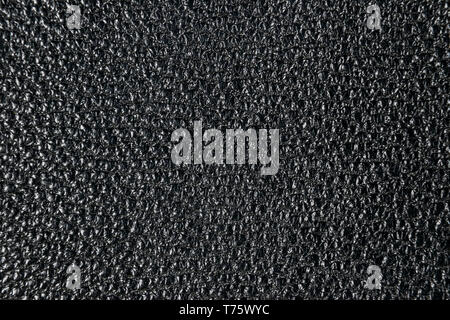 Black perforated leather texture background. Pink Leather close up. Macro shot of shiny leather texture. Texture background Stock Photo