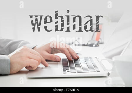 Webinar online, internet education, e-learning concept. Man typing on laptop keyboard. Stock Photo