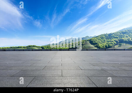 Empty square floor and green mountain natural landscape Stock Photo