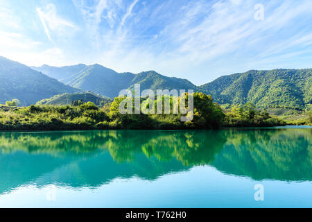 Beautiful mountains and green reflections Stock Photo