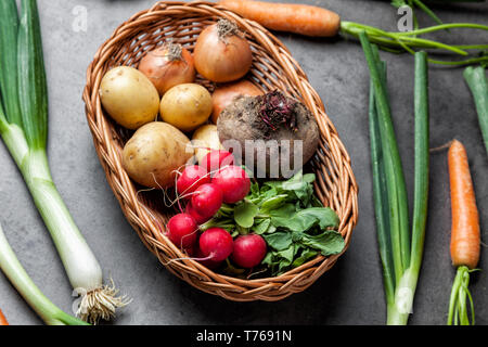 Fresh and healthy organic root vegetables on a rustic background Stock Photo