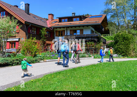 Family on nature trail in springtime near Ofterschwang in Upper Allgäu Stock Photo