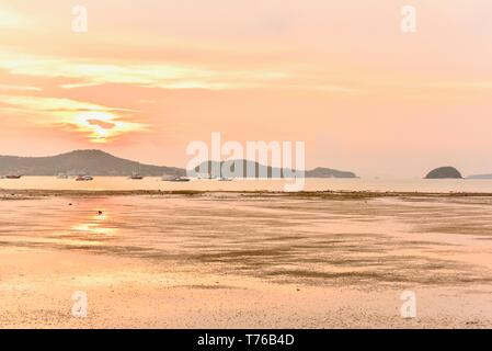 Blazing Sunset Skies Over the Andaman Sea Near Rawai Beach in Phuket Stock Photo