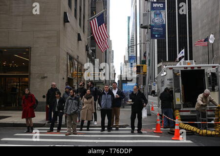 New York City, NY - March 10, 2017: Unidentified people waiting for the street light in Manhattan, NY Stock Photo