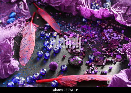 Composition with different items in purple colors on dark background Stock Photo