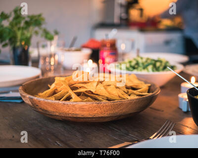 Taco or nachos dinner. Table with mexican bowls. Stock Photo