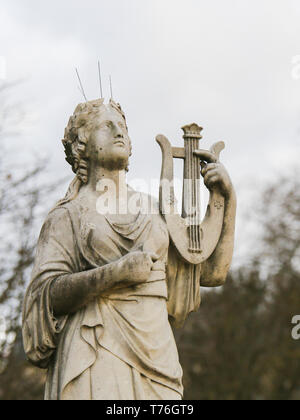 Statue of Calliope, in Greek Mythology the muse who presides over eloquence and epic poetry, holding a lyre in the Jardin de Luxembourg, Paris, France Stock Photo