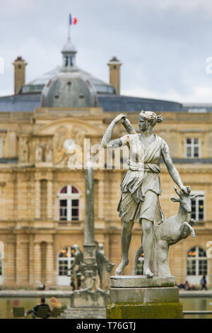 Statue of Diana, a Roman goddess of the hunt, the Moon, and nature, in the Jardin du Luxembourg housing the French Senate in Paris, France Stock Photo