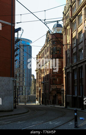 Tram lines, Hanover Building, Balloon Street, leading down to Corporation Street, Manchester, UK Stock Photo