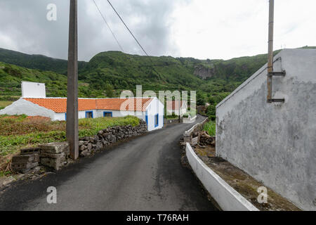Small road going through Fajazinha on Flores island in the Azores. Stock Photo