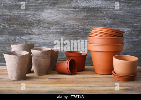 Pots for gardening on wooden background Stock Photo