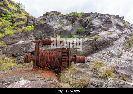 An old rusty winch in Santa Cruz das Flores showing the Azores whaling Past. Stock Photo