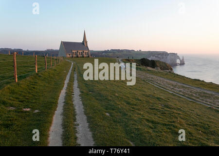 Cliff tops at Etretat, Normandy France and chapel of Notre Dame de la Garde Stock Photo