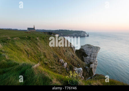 Cliff tops at Etretat, Normandy France and chapel of Notre Dame de la Garde Stock Photo
