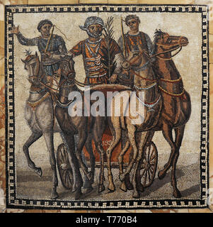 Quadriga of the factio russata. The auriga of the winning team (red) raises the palm as a symbol of triumph. Roman mosaic. 3rd century AD. Limestone. From Rome, Italy. National Archaeological Museum. Madrid. Stock Photo