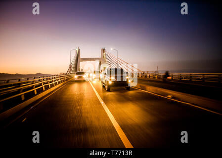 Crossing Mactan Bridge, Cebu, Philippines at twilight. Stock Photo