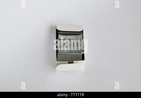 stapler wire in paper box on white background Stock Photo