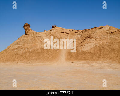 Mountain in the desert of Tunisia, in form resembling a camel against a blue sky Stock Photo