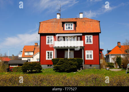 Mariefred, Sweden - May 5, 2018: Exterior view of a red wooden single family two story building. Stock Photo