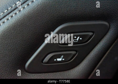 Close up shot of modern car central console with seat controls Stock Photo