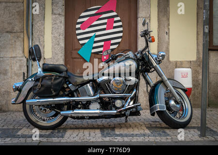 Harley Davidson Classic Softail motorcycle, parked on a cobbled street in Porto, Portugal. Stock Photo