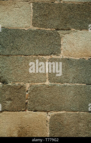 Close-up of old wall made of large stone bricks, forming a charming background at Campo Maior. A town with medieval influences in eastern Portugal. Stock Photo