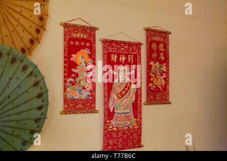MEXICALI, MEXICO - April 8 Chinese religious figures decorates the wall of a watch shop basement located downtown April 8, 2019 in Mexicali, Mexico. U Stock Photo