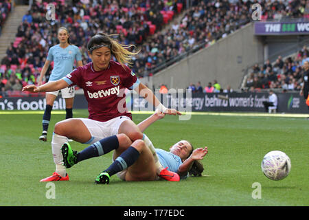 London, UK. 04th May, 2019. Cho So-Hyun of West Ham United is tackled by Abbie McManus of Manchester City during the FA Women's Cup Final match between Manchester City Women and West Ham United Ladies at Wembley Stadium on May 4th 2019 in London, England. Credit: PHC Images/Alamy Live News Stock Photo