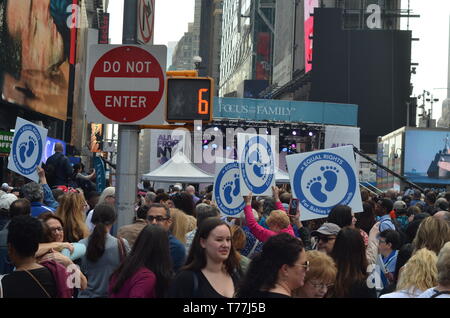 New York, USA. 4th May, 2019. Participants seen holding placards during the Abortion rally at the Times Square in New York.People gathered in Times Square to protest against abortion law in New York State, the law legalizes late term abortion until the moment of birth. During the demonstration a doctor performed a live 4D ultrasound showing an unborn baby in the womb & callousness of late term abortion. Credit: Ryan Rahman/SOPA Images/ZUMA Wire/Alamy Live News Stock Photo