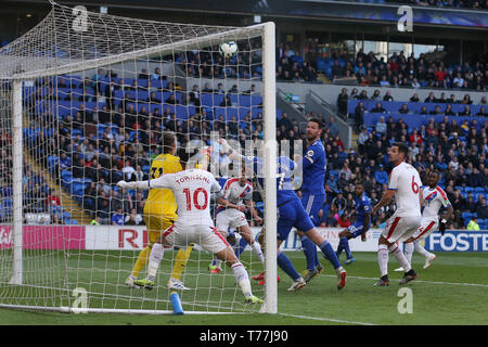 Cardiff, UK. 04th May, 2019. Vicente Guaita, the goalkeeper of Crystal Palace FC saves from Sean Morrison and Aron Gunnarsson of Cardiff city (17). . Premier League match, Cardiff City v Crystal Palace at the Cardiff City Stadium on Saturday 4th May 2019.  this image may only be used for Editorial purposes. Editorial use only, license required for commercial use. No use in betting, games or a single club/league/player publications. pic by  Andrew Orchard/Andrew Orchard sports photography/Alamy Live news Credit: Andrew Orchard sports photography/Alamy Live News Stock Photo