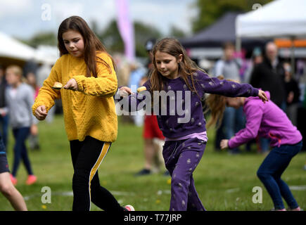 Dorset, UK. 05th May, 2019. Dorset Knob Throwing Festival, Kingston Maurward, Dorchester. Children have a go at The  Knob and Spoon Race. Credit: Finnbarr Webster/Alamy Live News Stock Photo