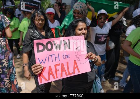 Beirut, Lebanon. 5th May, 2019. A protester seen holding a placard that says Down with the Kafala during the demonstration.Hundreds of people from different nationalities marched to protest for the rights of migrant workers, shouting slogans and holding banners calling for the abolishment of Lebanon's controversial kafala sponsorship system. Credit: Adib Chowdhury/SOPA Images/ZUMA Wire/Alamy Live News Stock Photo