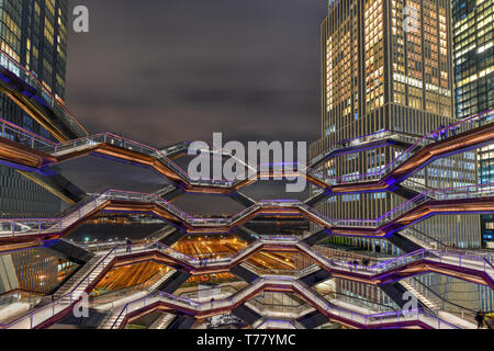 New York City - March 15, 2019: The Vessel, also known as the Hudson Yards Staircase (designed by architect Thomas Heatherwick) at dusk in Midtown Man