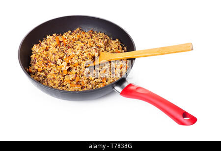 assorted cooked rice with vegetables in a frying pan on white isolated background Stock Photo