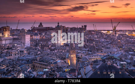 Genova, Italy: Beautiful sunset aerial panoramic view of Genoa historic centre old town (San Lorenzo Cathedral, duomo, Palazzo Ducale), sea and port Stock Photo