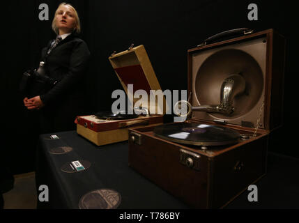 Portable gramophones made by the Decca Gramophone Company on display, during the one-day event Decca 90: A Celebration, at the V&A in London. Stock Photo