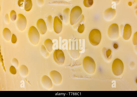 close up of a slice of emmental or emmentaler cheese Stock Photo