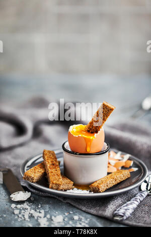 Soft boiled egg with rye toasts for breakfast Stock Photo