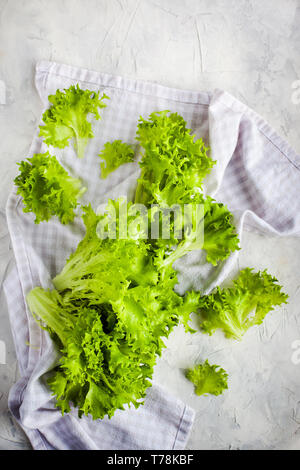 Fresh raw green frillice iceberg lettuce salad on table, top view Stock Photo