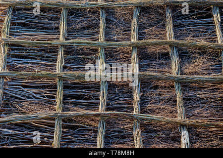 Abstract pattern background, natural floor made from tree branches with lattice grating Stock Photo